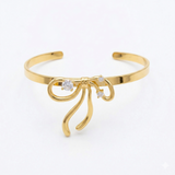 Gold bow tie bangle
